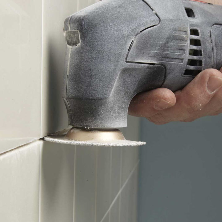 Oscillating tool blade to store cut tile